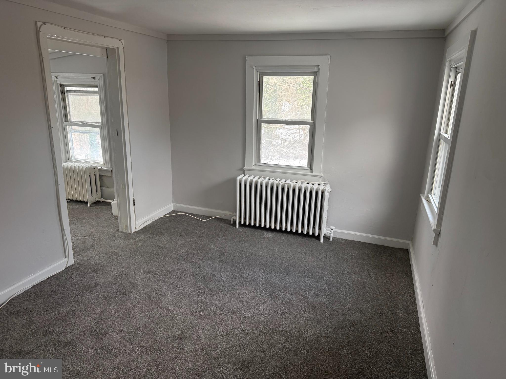116 Walnut Street Bordentown, NJ 08505 - Photo 11 of 13 an empty room with windows