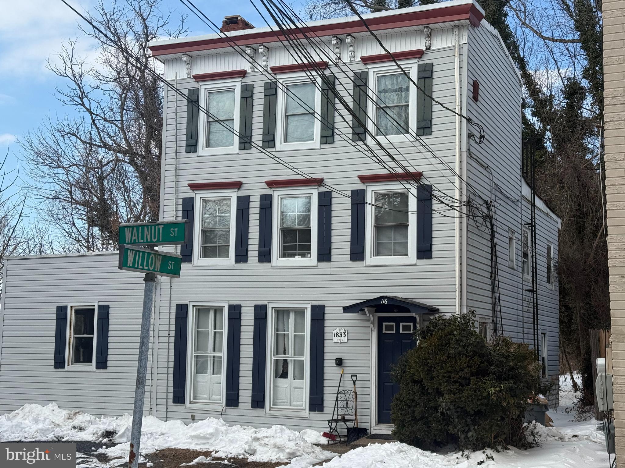 116 Walnut Street Bordentown, NJ 08505 - Photo 2 of 13 a front view of a house with garden