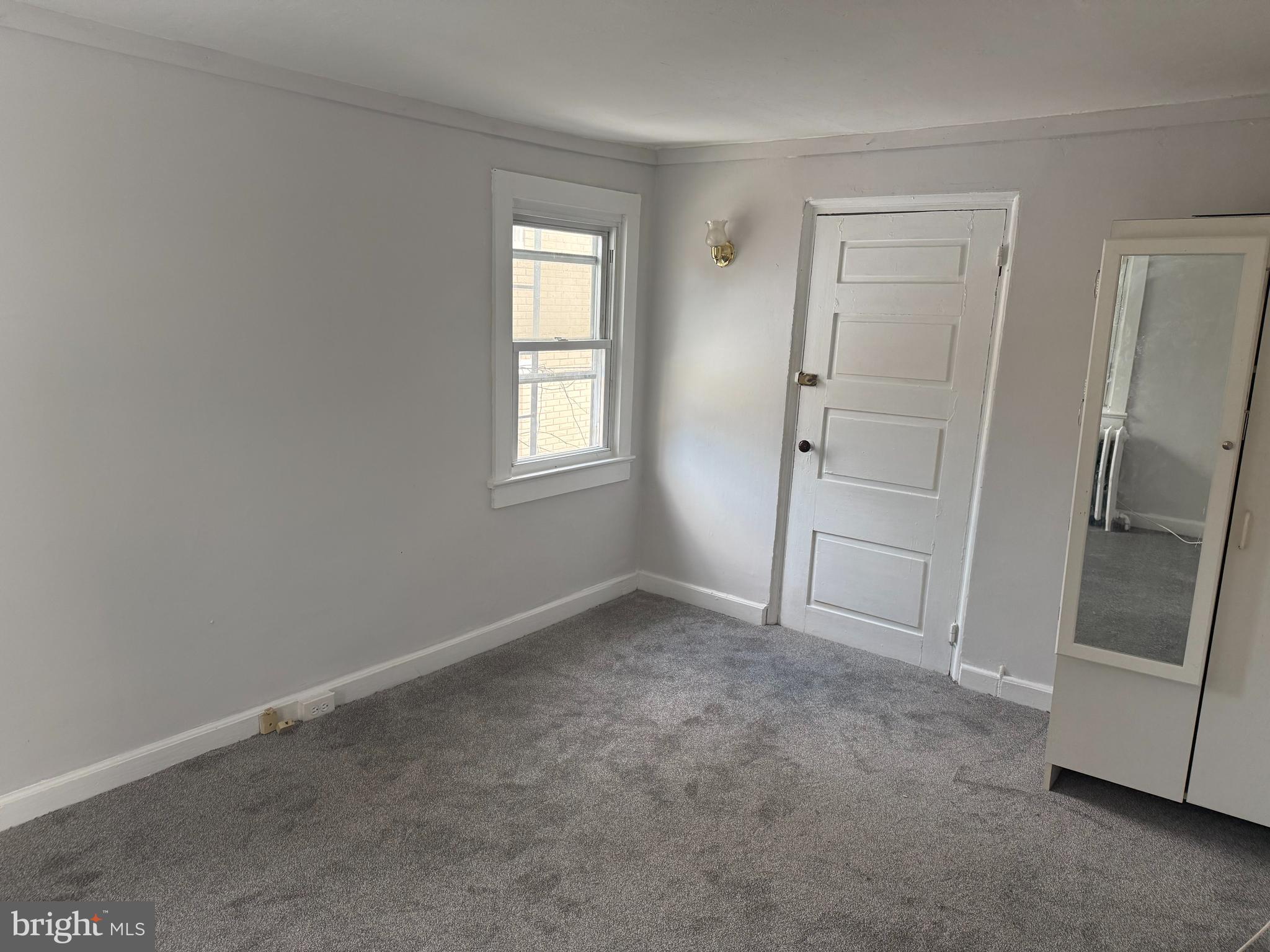 116 Walnut Street Bordentown, NJ 08505 - Photo 5 of 13 an empty room with a door