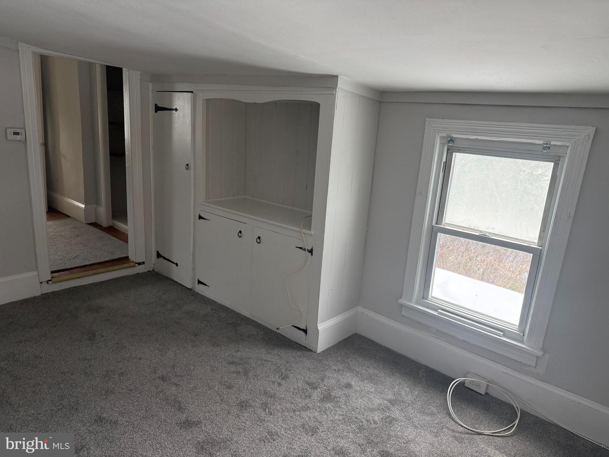 116 Walnut Street Bordentown, NJ 08505 - Photo 8 of 13 an empty room with windows