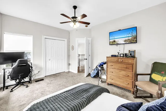 a bathroom with a tub a sink and a window