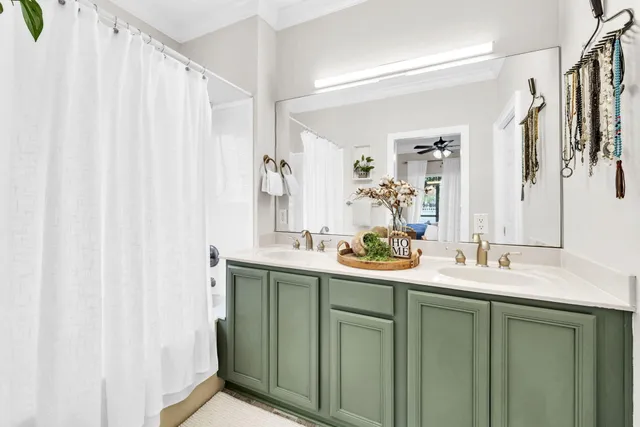 a bedroom with a bed and a wall painting