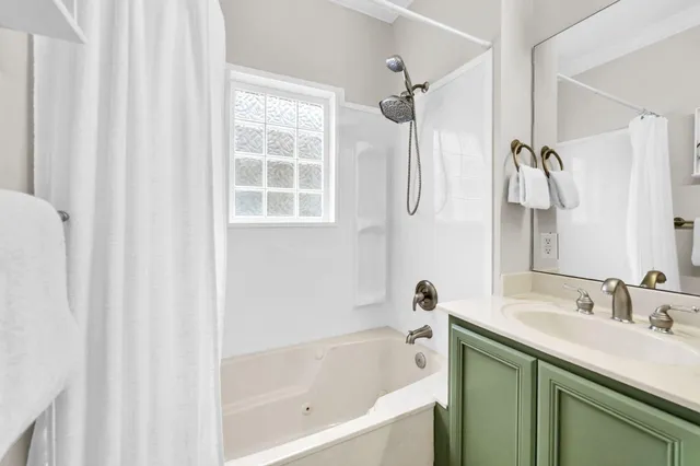 a bedroom with furniture and a flat screen tv