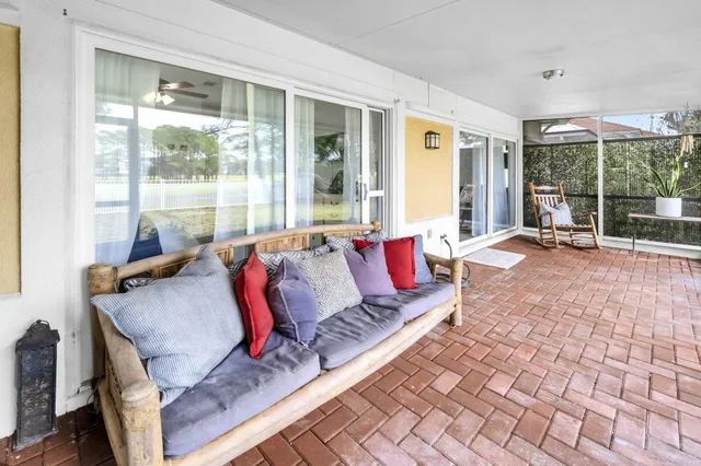 a view of a room with wooden floor and outdoor space