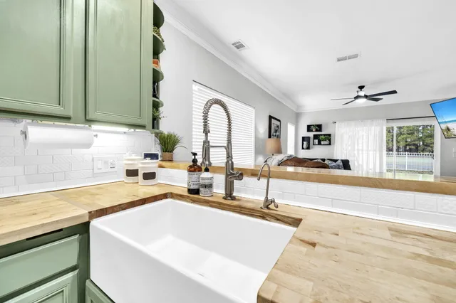 a spacious bathroom with a sink and a large mirror