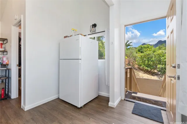 a white refrigerator freezer and a window