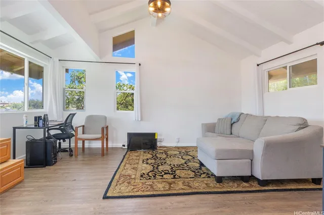 a living room with furniture rug and window
