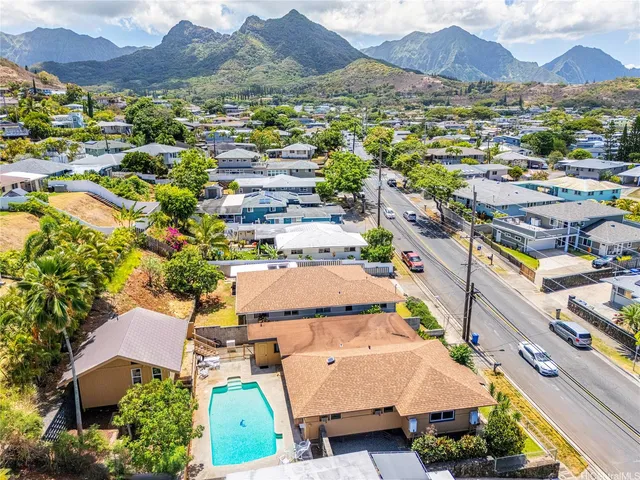an aerial view of residential houses and outdoor space