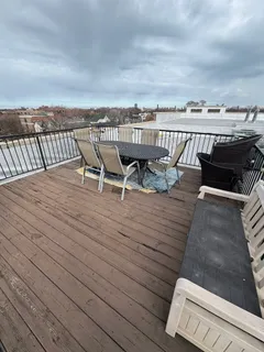 a view of roof deck with patio