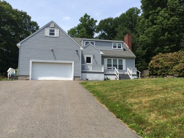 22 Ingram Road Leicester, MA 01611 - Photo 1 of 8 a front view of a house with a yard and garage
