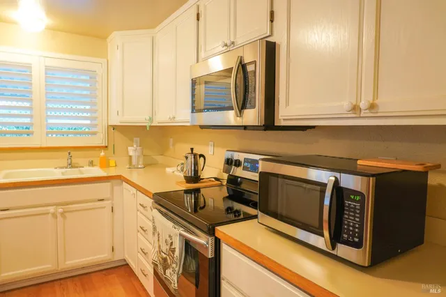 a kitchen with a sink and cabinets