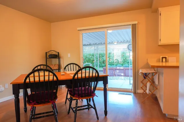 a view of a chairs and table in the patio