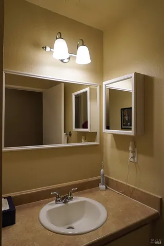 a bathroom with a sink and a mirror