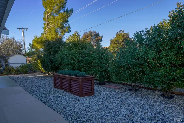 a backyard of a house with lots of green space