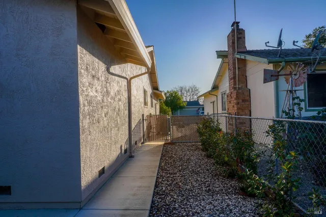 a view of a house with brick walls