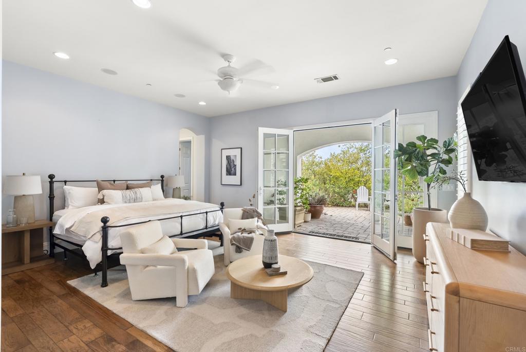 3401 Adams Run Encinitas, CA 92024 - Photo 11 of 18 a living room with furniture a flat screen tv and a large window