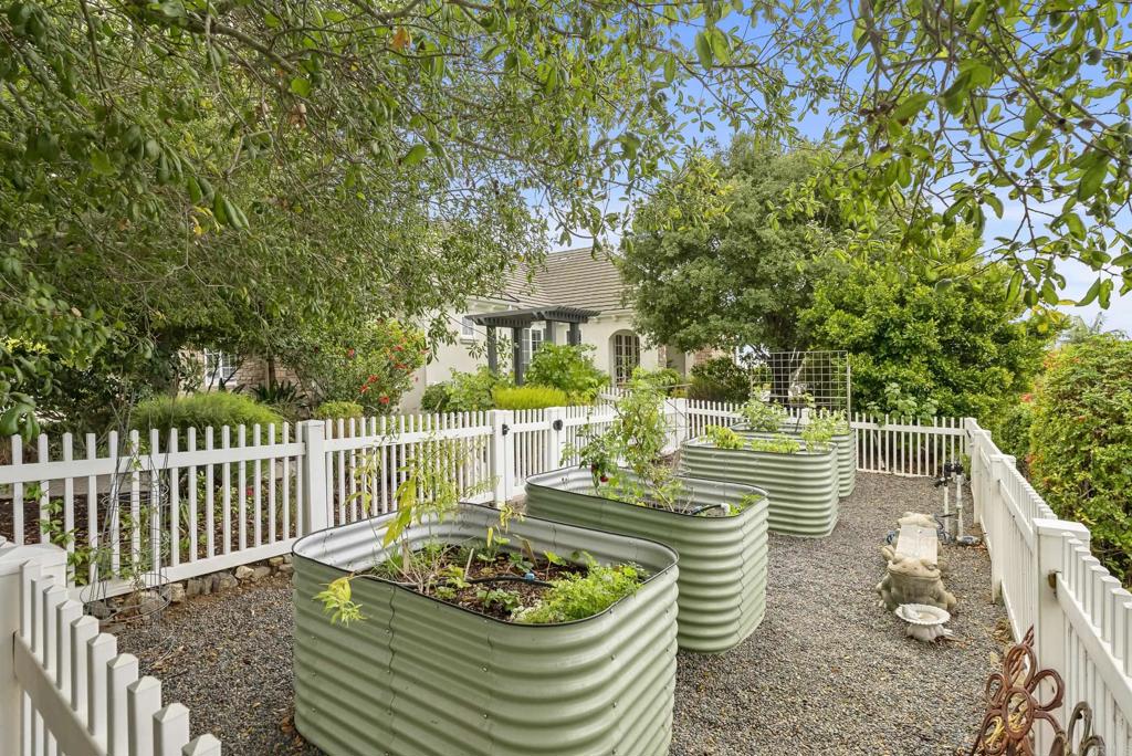 3401 Adams Run Encinitas, CA 92024 - Photo 16 of 18 a front view of a house with a garden