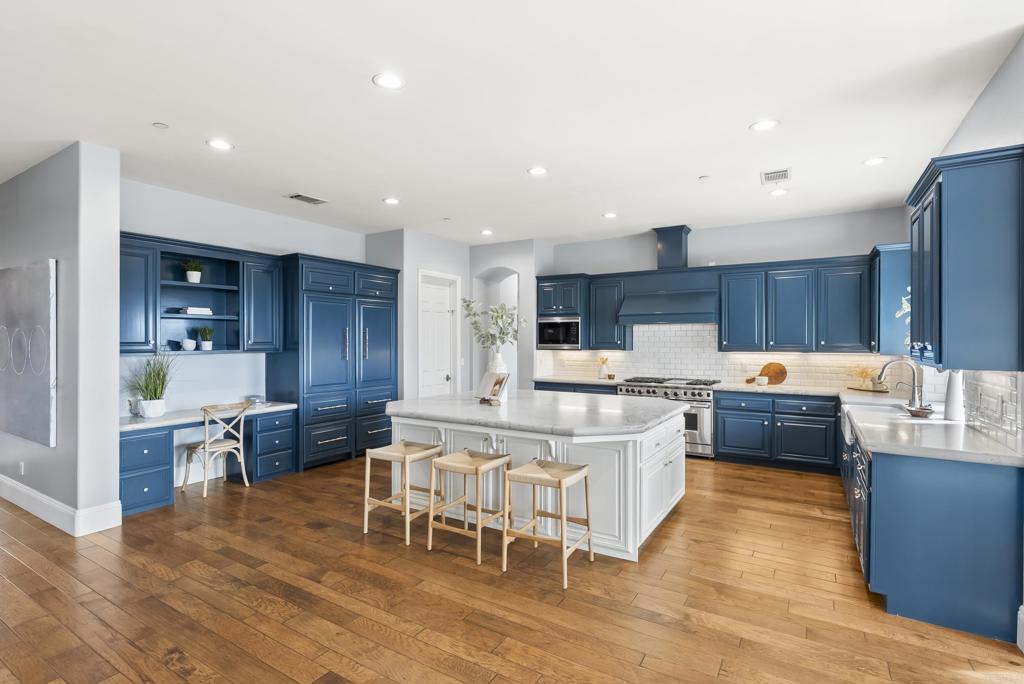 3401 Adams Run Encinitas, CA 92024 - Photo 4 of 18 a large kitchen with a table and chairs
