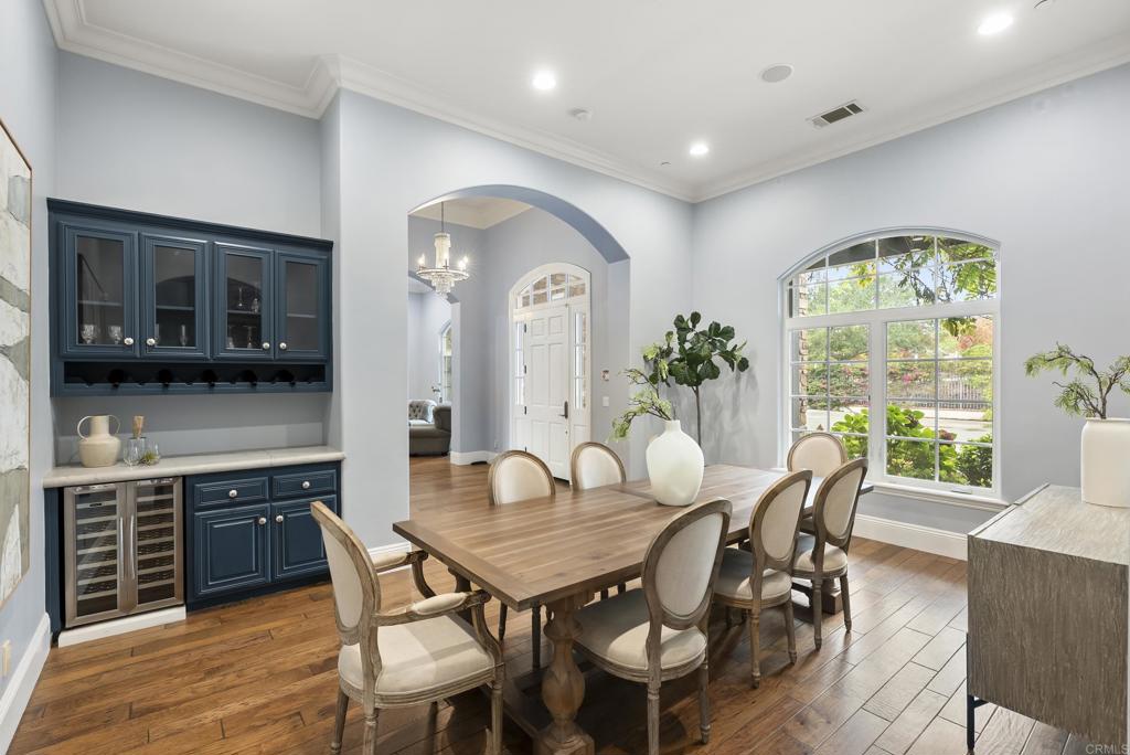 3401 Adams Run Encinitas, CA 92024 - Photo 10 of 18 a view of a dining room with furniture window and wooden floor