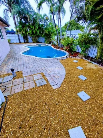 a view of a backyard with a fountain