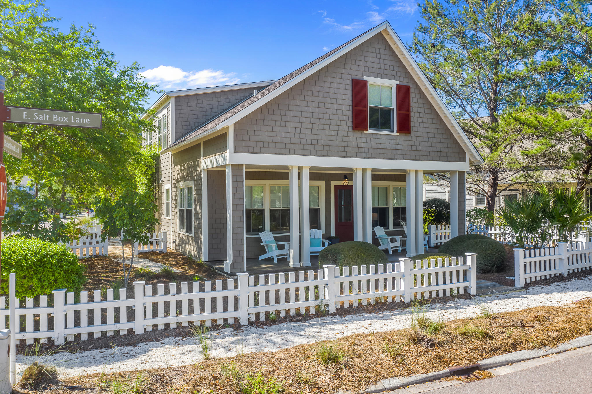 290 Salt Watersound, FL 32461 - Photo 1 of 45 a front view of a house with a garden