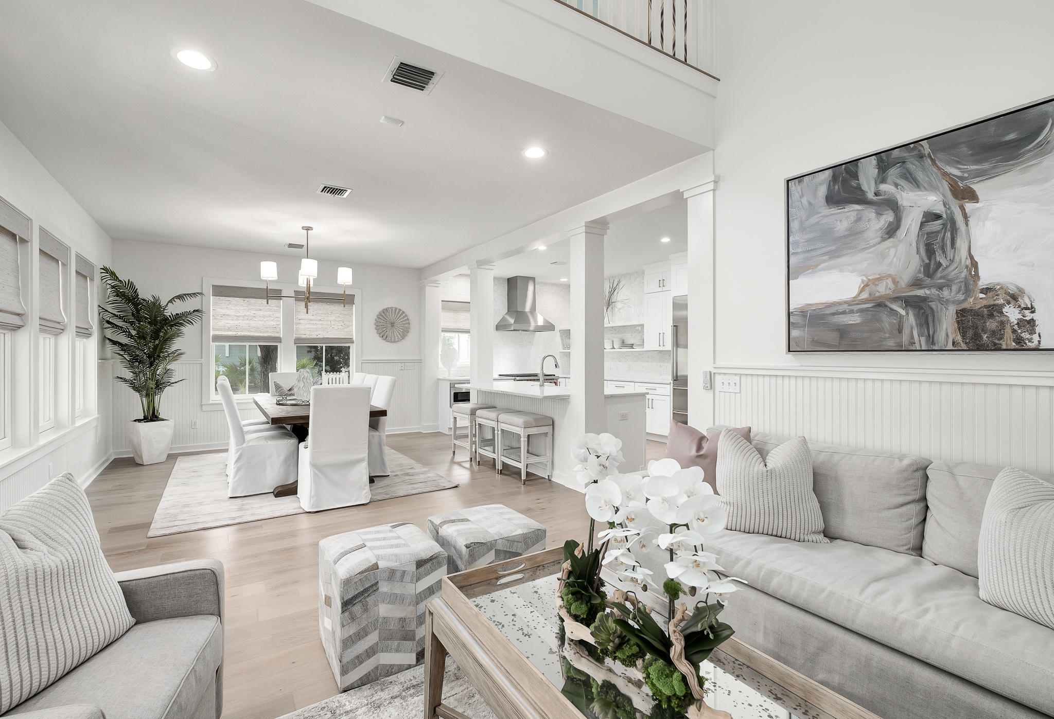 290 Salt Watersound, FL 32461 - Photo 2 of 45 a living room with furniture flowers and a chandelier