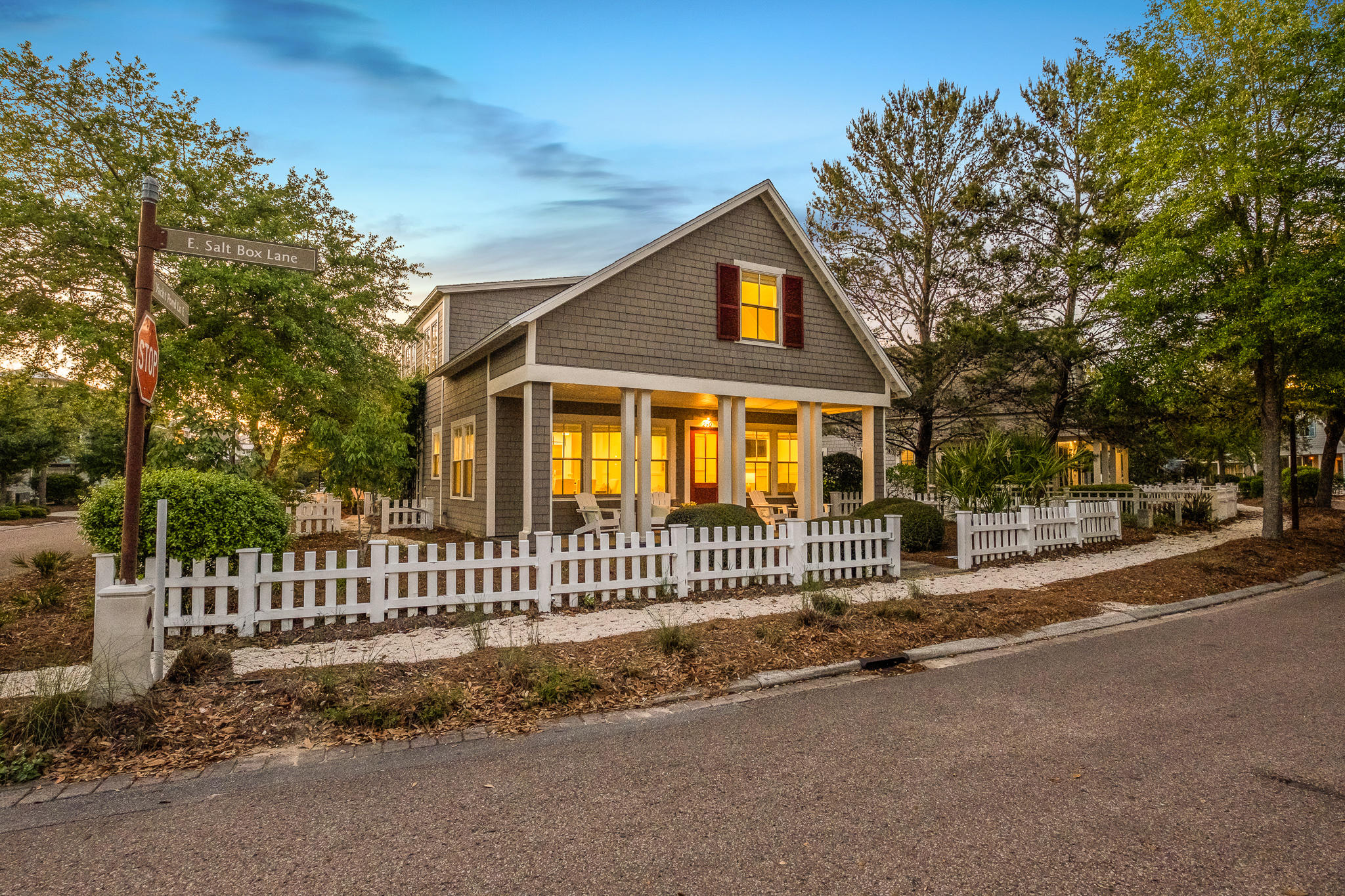 290 Salt Watersound, FL 32461 - Photo 12 of 45 a front view of a house with a garden