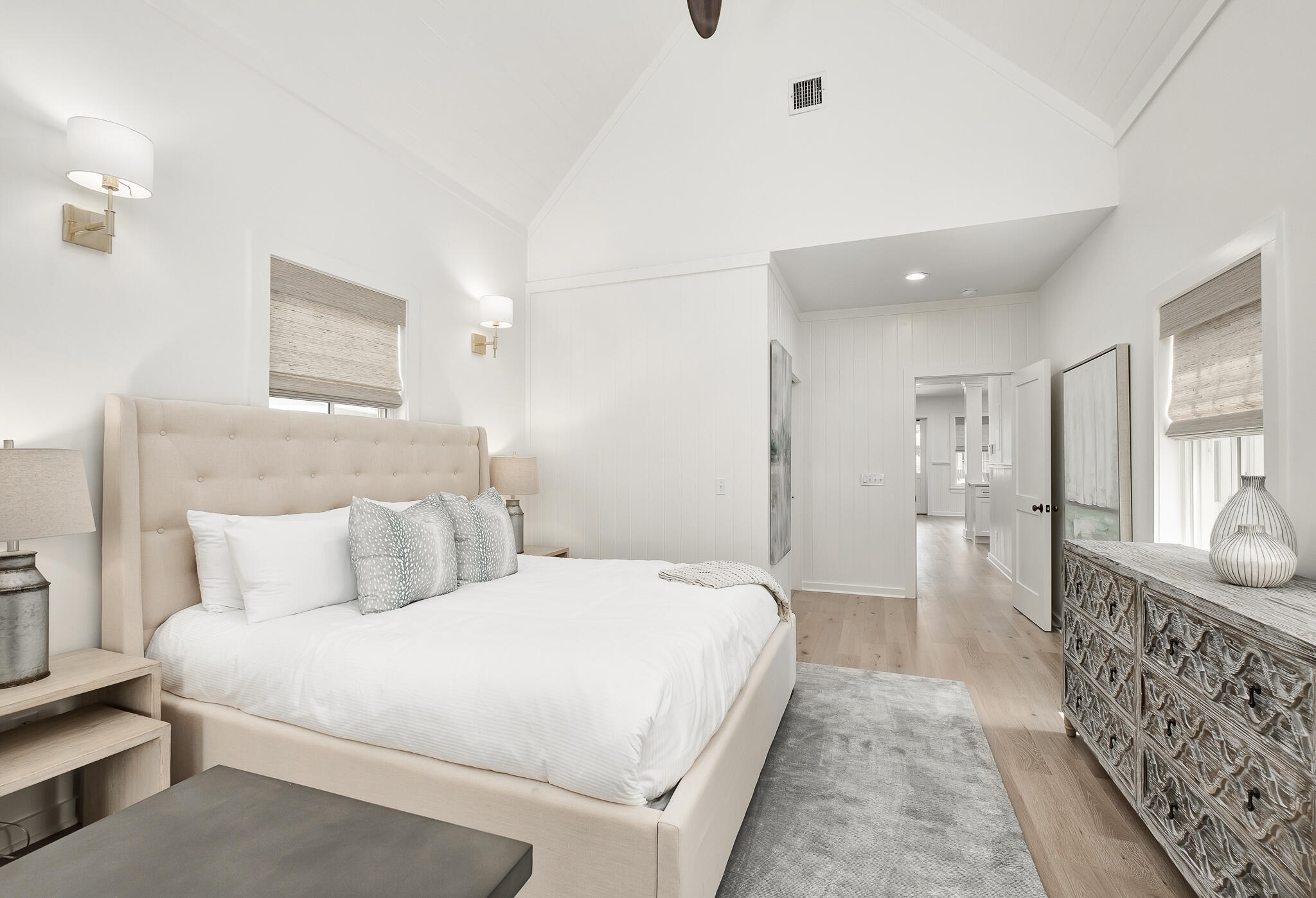 290 Salt Watersound, FL 32461 - Photo 18 of 45 a bedroom with a bed and walk in closet