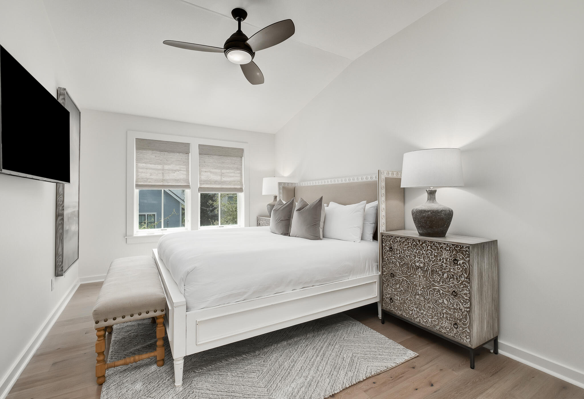 290 Salt Watersound, FL 32461 - Photo 23 of 45 a bedroom with a bed a flat screen tv and balcony