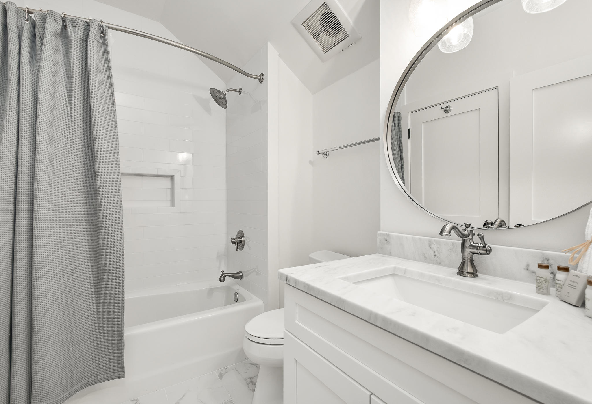 290 Salt Watersound, FL 32461 - Photo 29 of 45 a bathroom with a granite countertop sink toilet and shower