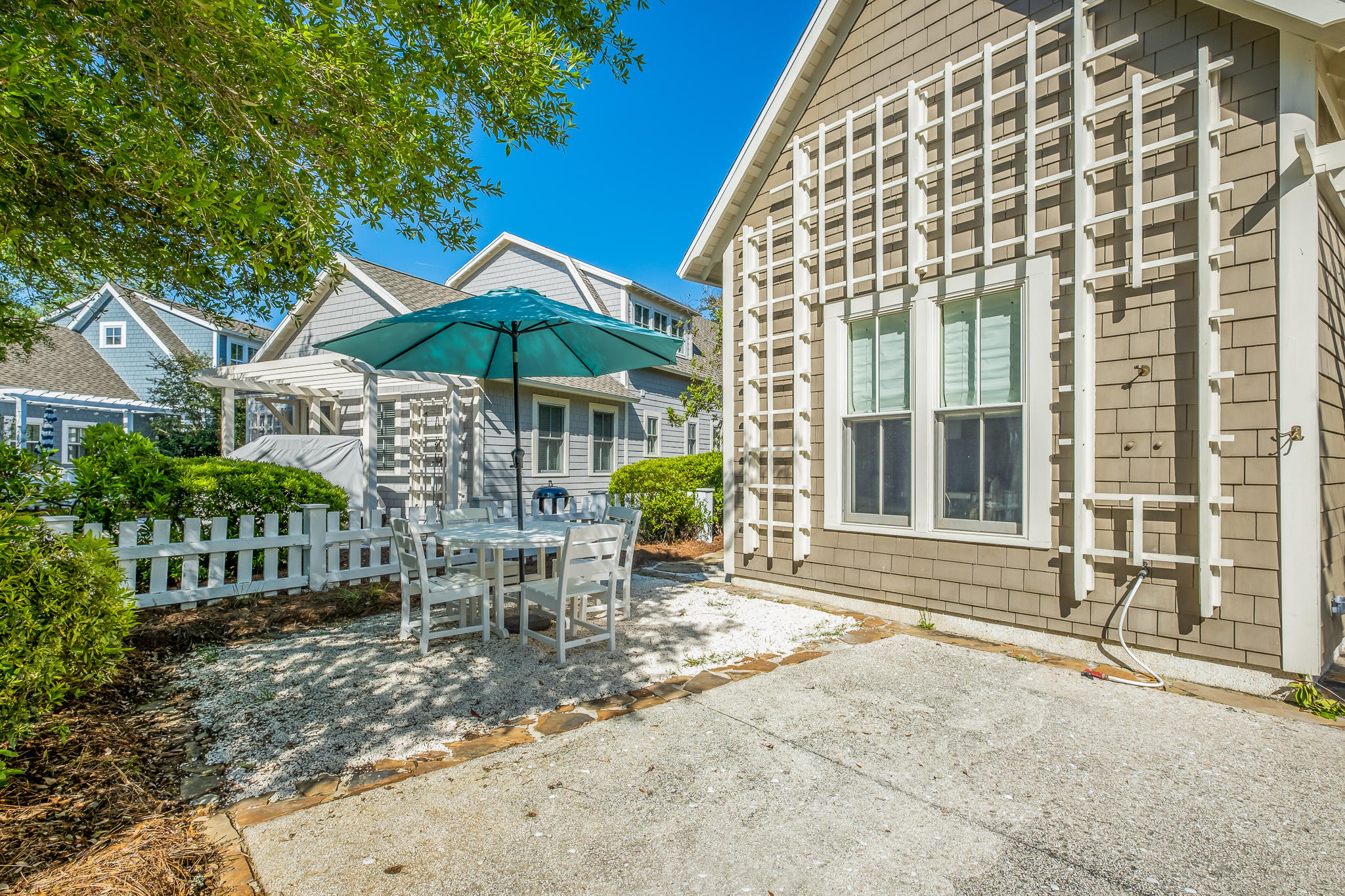 290 Salt Watersound, FL 32461 - Photo 32 of 45 a view of a house with backyard and sitting area