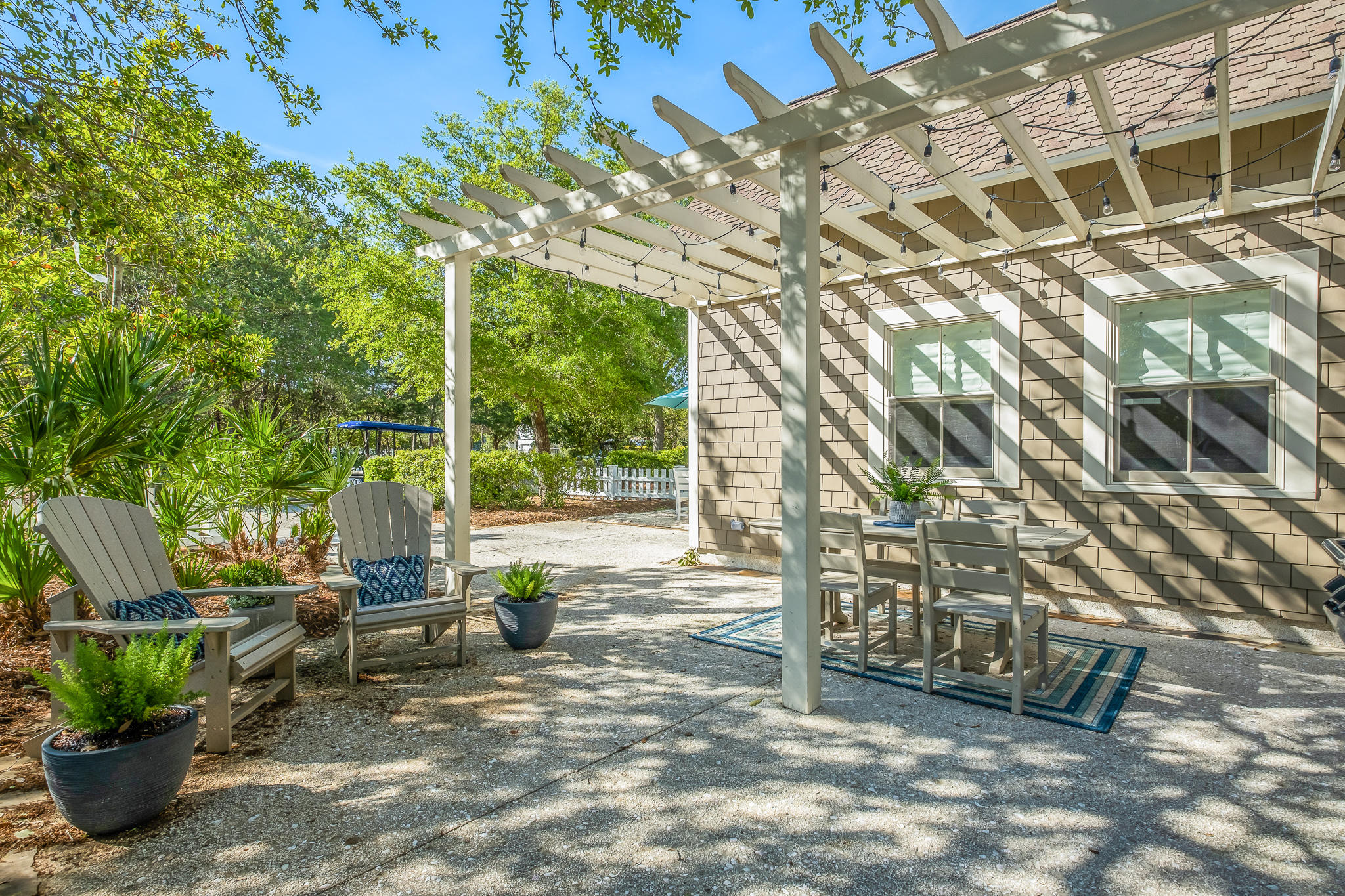 290 Salt Watersound, FL 32461 - Photo 34 of 45 a view of outdoor space with seating area and trees