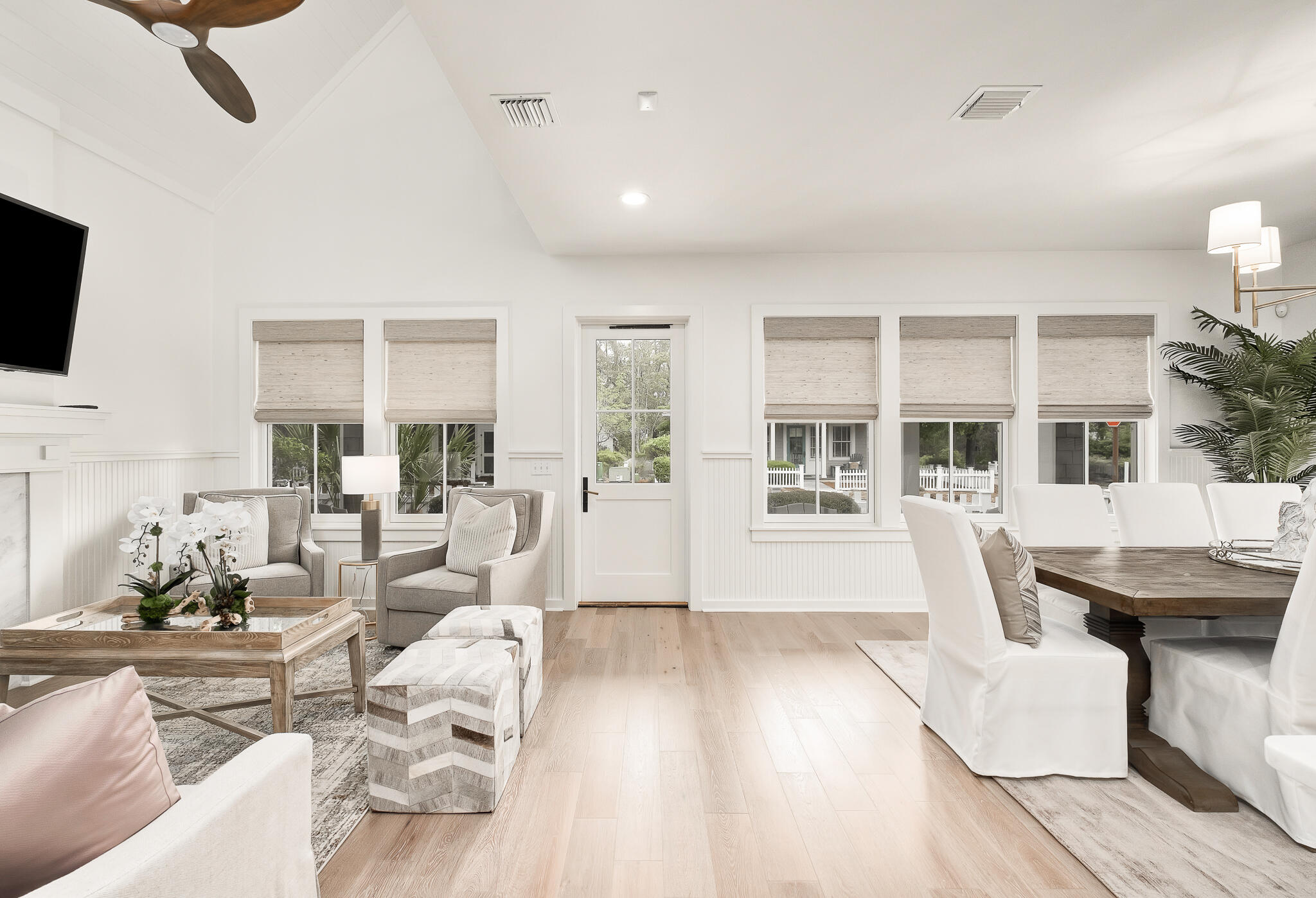 290 Salt Watersound, FL 32461 - Photo 5 of 45 a living room with fireplace furniture and a flat screen tv