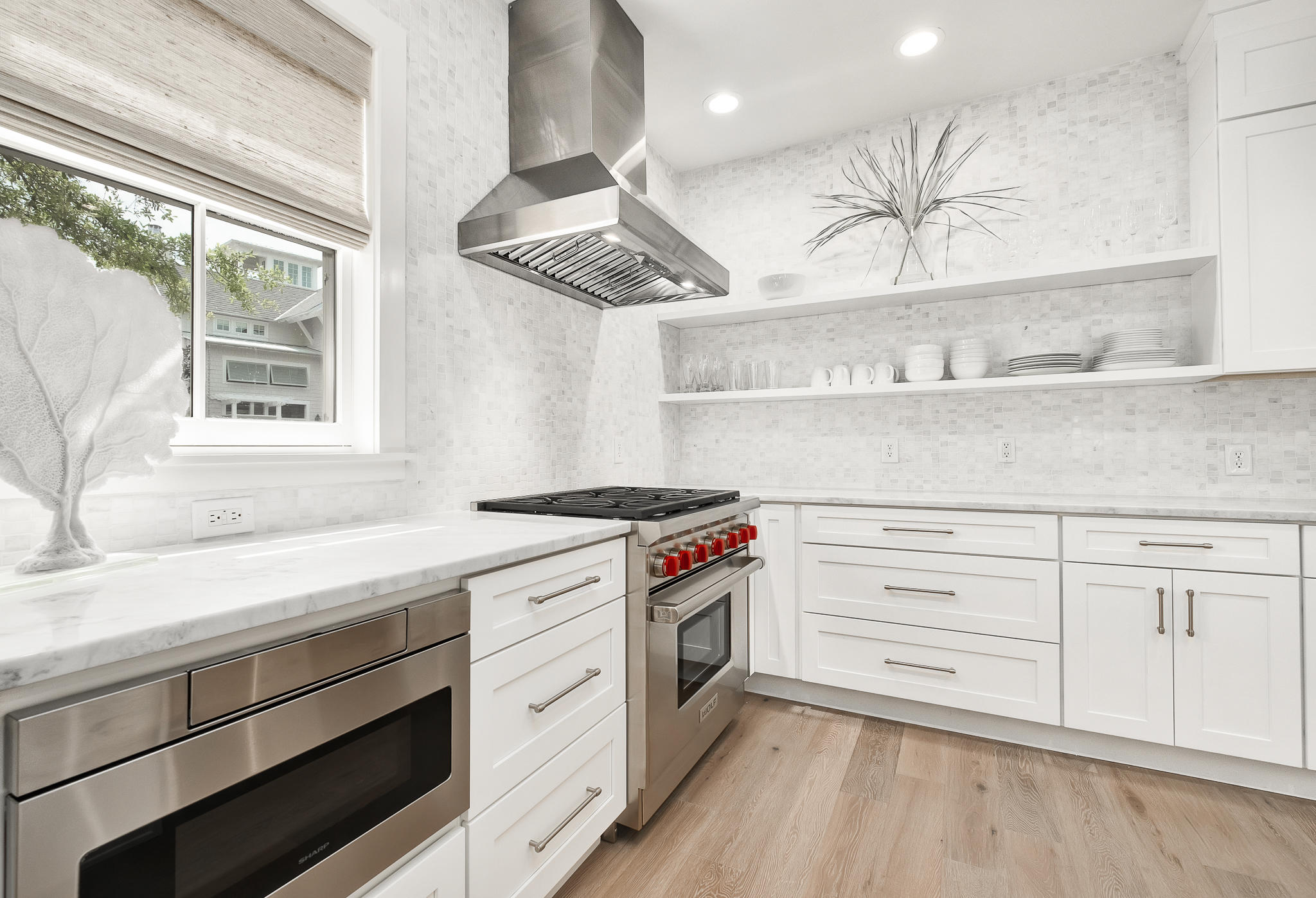 290 Salt Watersound, FL 32461 - Photo 7 of 45 a kitchen with stainless steel appliances a stove and cabinets