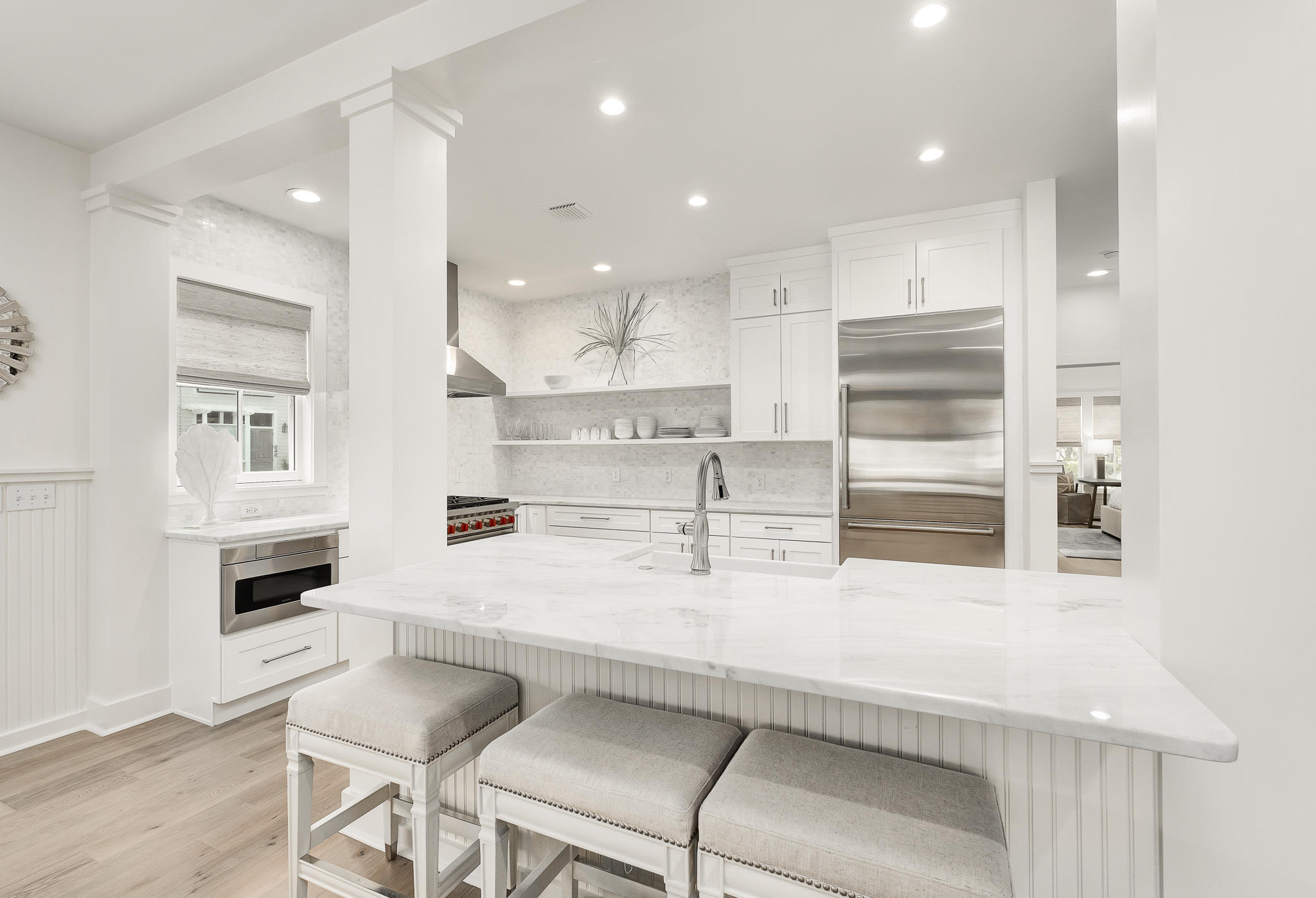 290 Salt Watersound, FL 32461 - Photo 8 of 45 a kitchen with stainless steel appliances kitchen island granite countertop a stove a sink and a refrigerator
