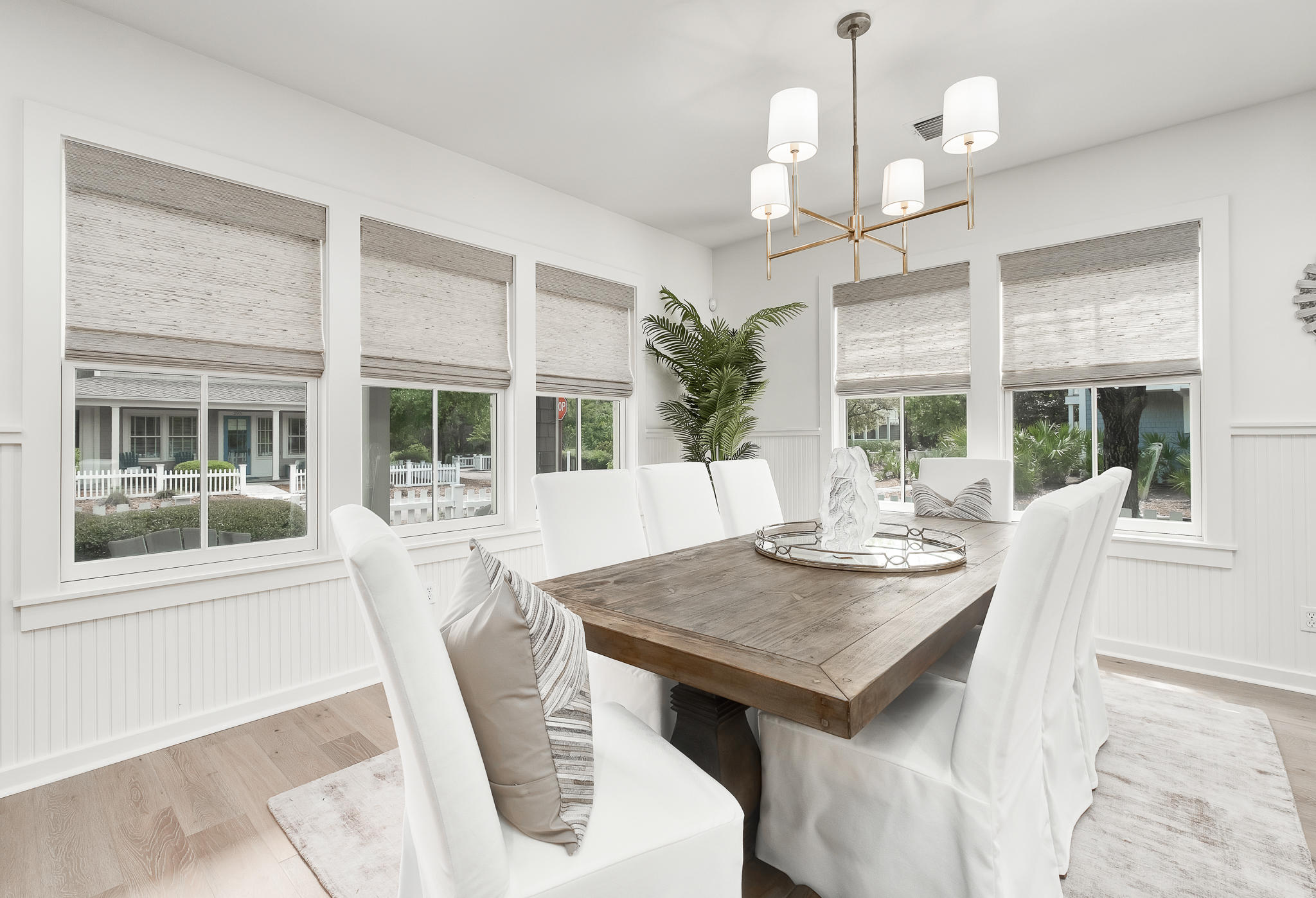 290 Salt Watersound, FL 32461 - Photo 10 of 45 a view of a dining room with furniture wooden floor and chandelier