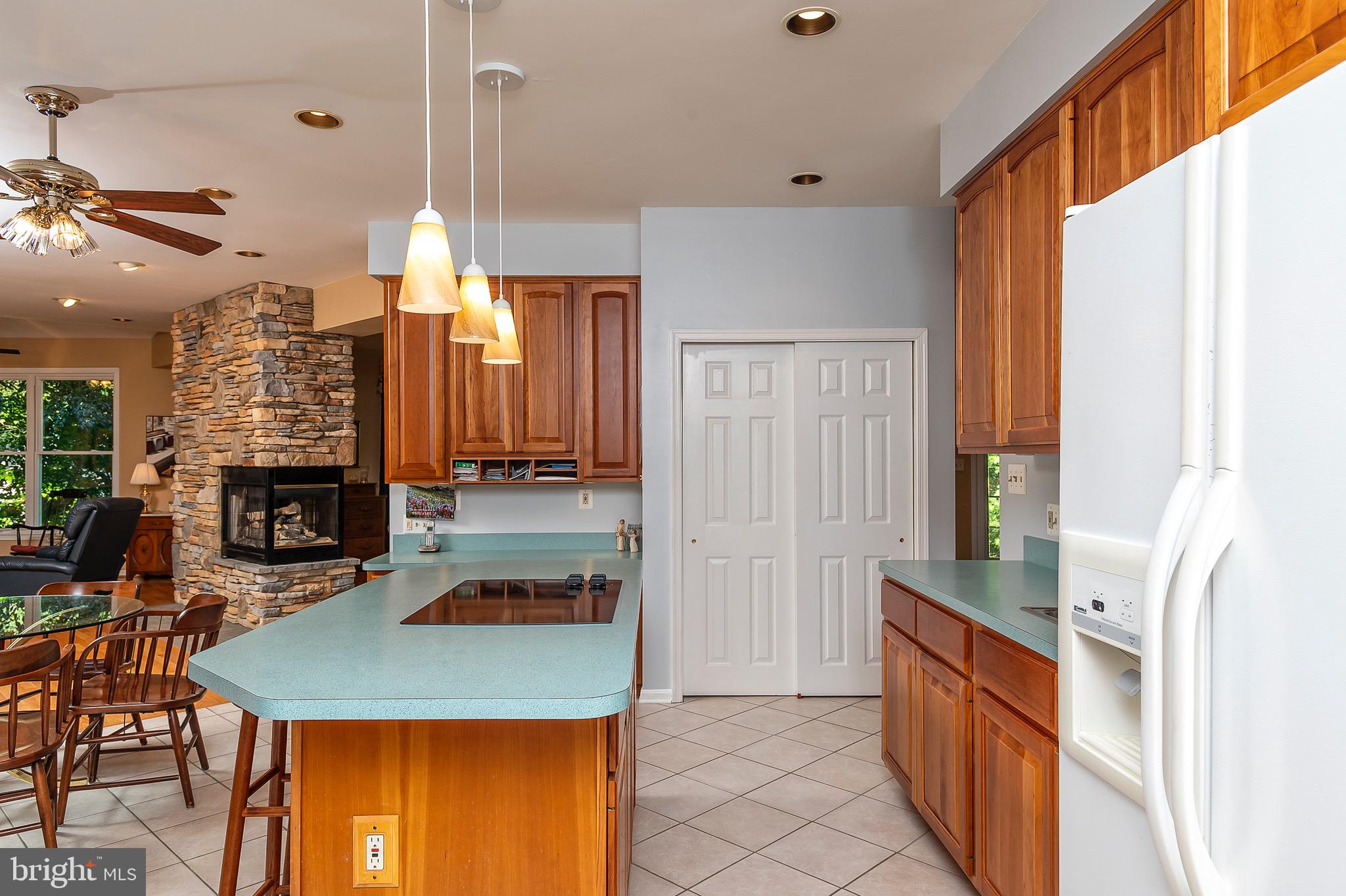 2420 SW Road Baltimore, MD 21234 - Photo 16 of 46 Functional island with cooktop and storage