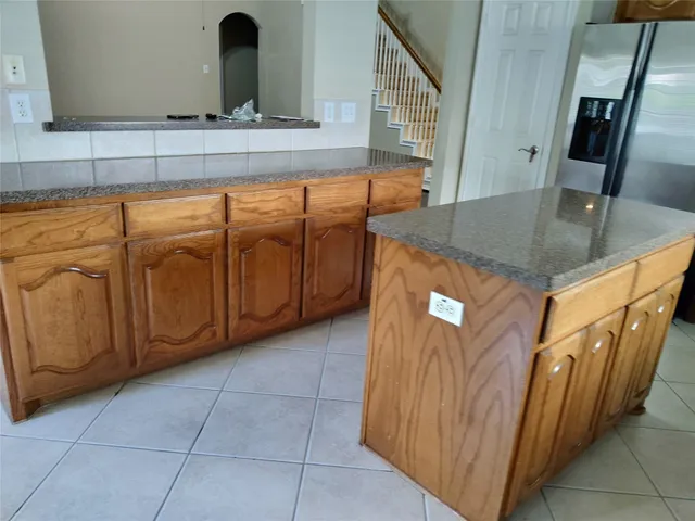 a view of a kitchen with furniture and staircase