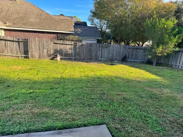 a swimming pool with wooden fence