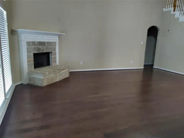 an empty room with a fireplace
