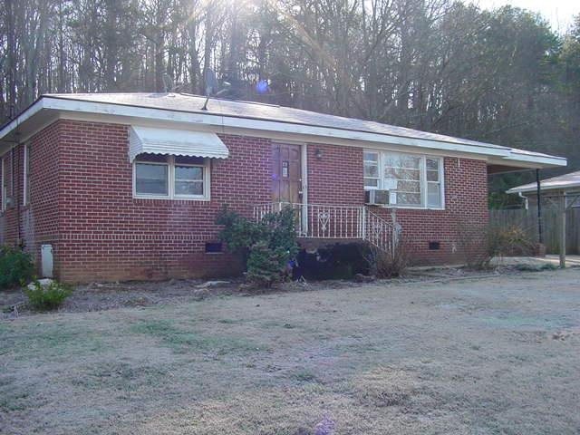 229 Alfred Avenue Southeast Rome, GA 30161 - Photo 1 of 1 a view of a house with a yard