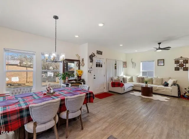 a view of a dining room with furniture window and wooden floor