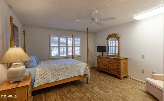 a bedroom with bed and window