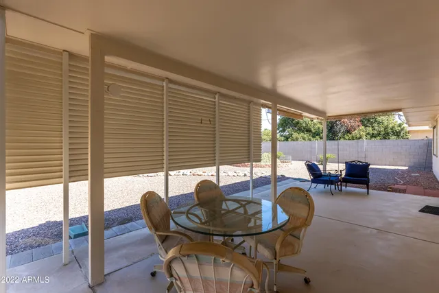 a view of a dining room with furniture and window