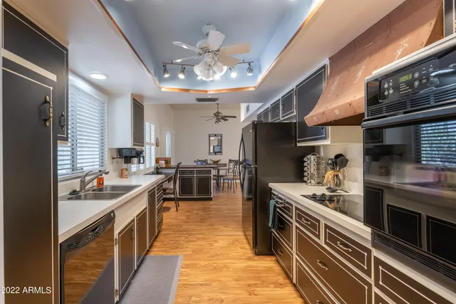 a kitchen with lots of counter top space and stainless steel appliances