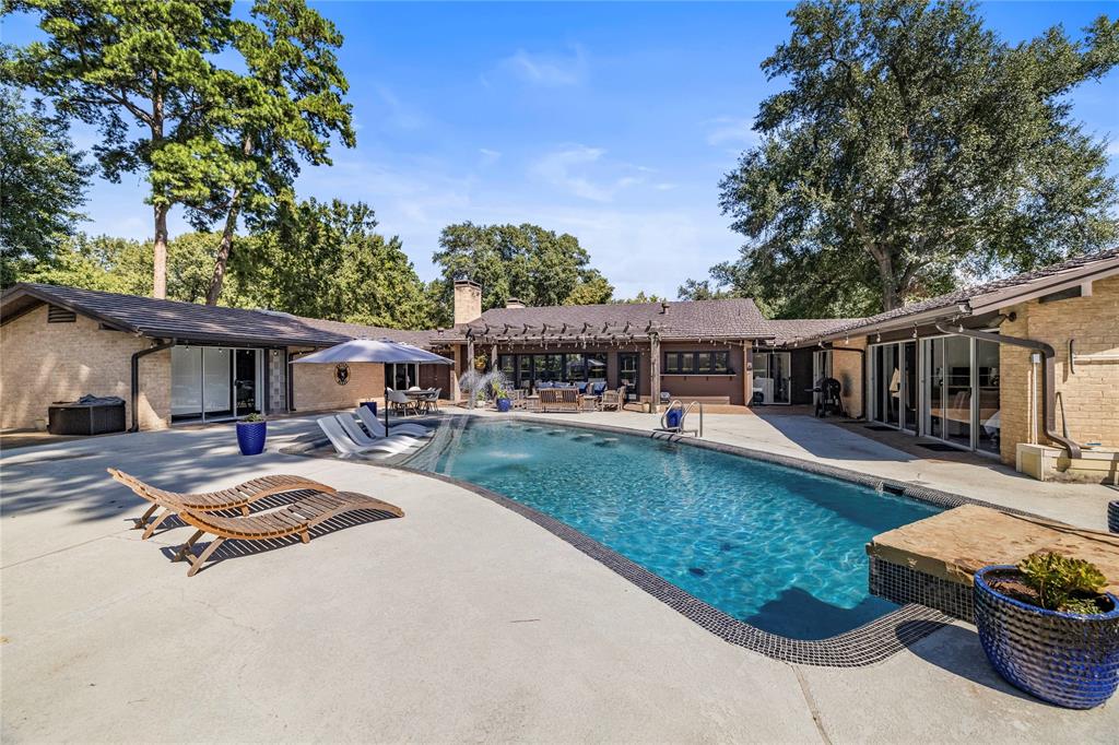 1300 Montclair Street Longview, TX 75601 - Photo 29 of 39 Swimming pool with a patio area and a pergola