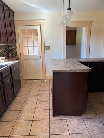 a kitchen with a cabinets and window