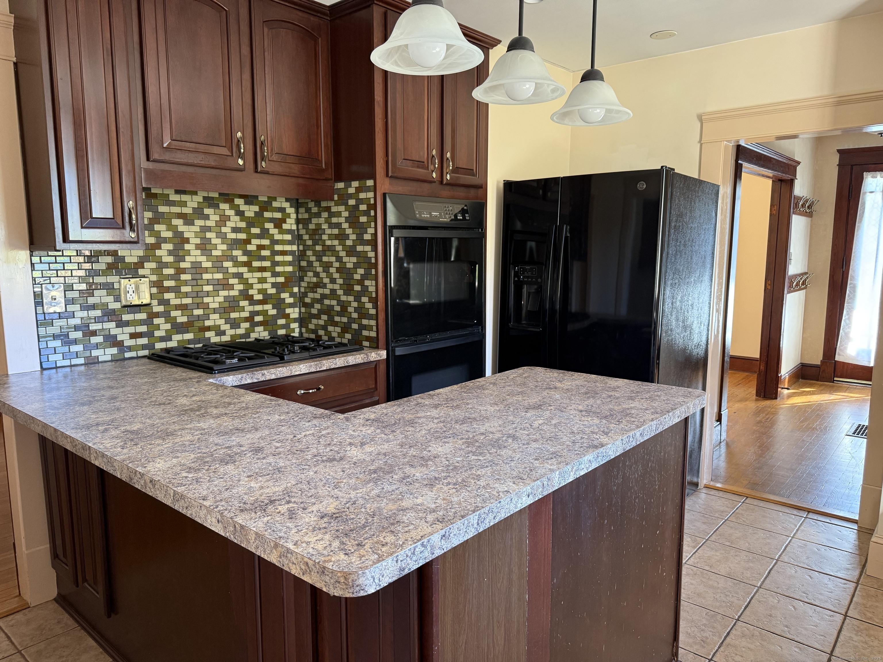 28 Galpin Street Naugatuck, CT 06770 - Photo 2 of 18 a kitchen with stainless steel appliances kitchen island granite countertop a refrigerator and a sink