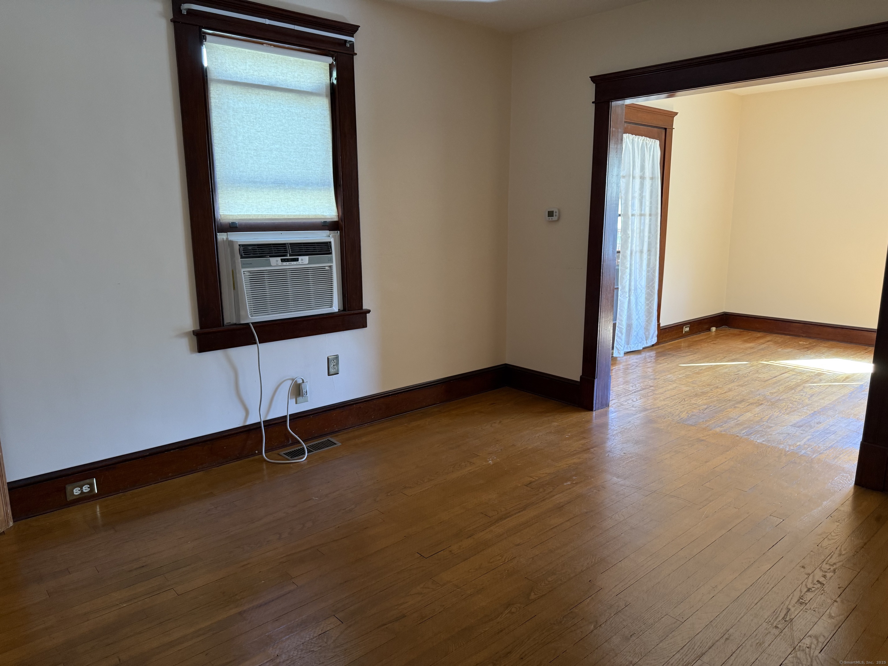 28 Galpin Street Naugatuck, CT 06770 - Photo 7 of 18 an empty room with wooden floor and windows