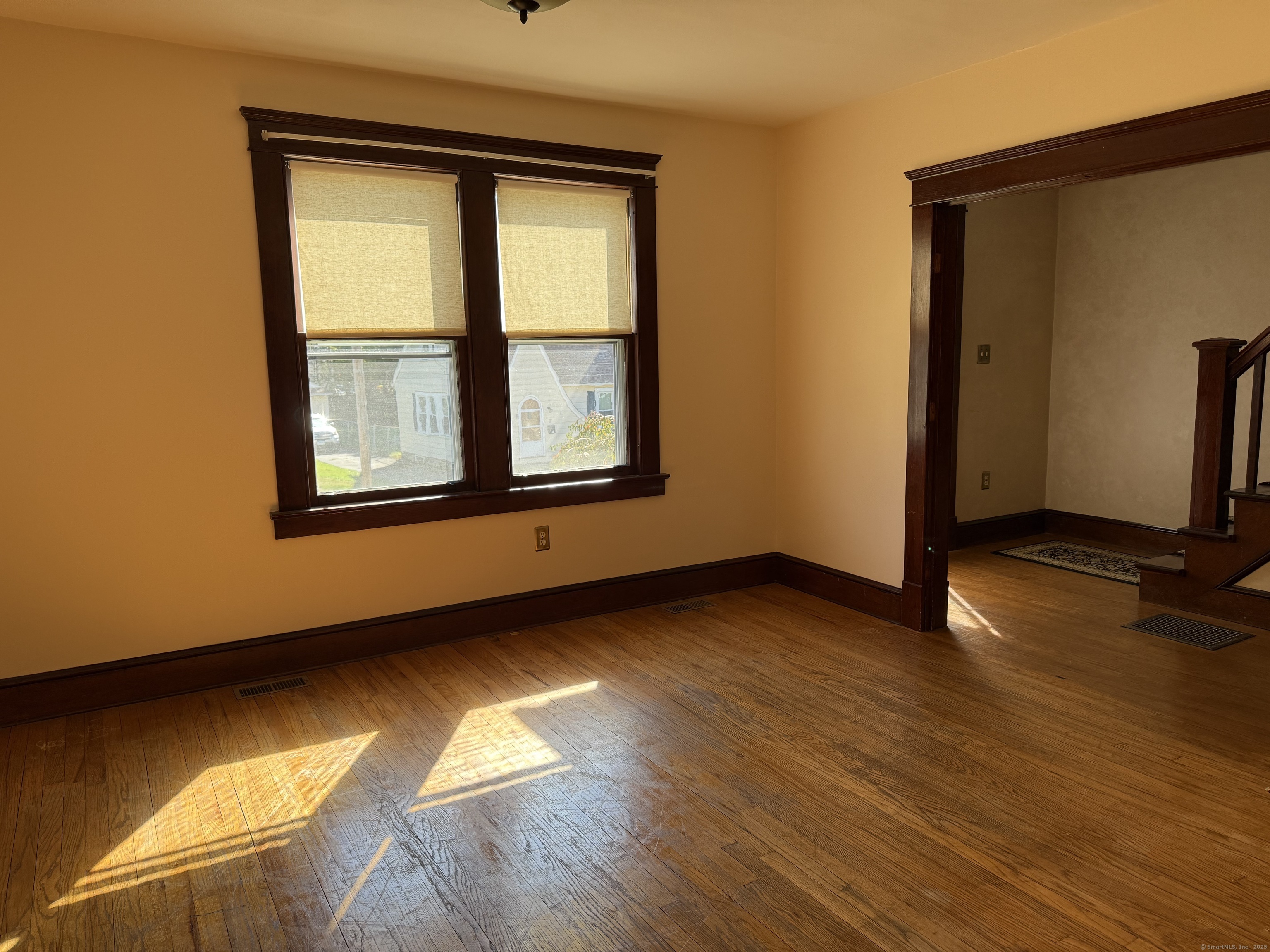 28 Galpin Street Naugatuck, CT 06770 - Photo 9 of 18 an empty room with wooden floor and windows